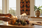 A chef’s spice and seasoning parcel being styled in a modern home kitchen, warm sunlight, hands opening the box, visible textures of spices, luxury yet approachable, Afro-Cali aesthetic, premium food gift set.